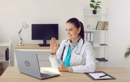 Student attending an online Medical Transcription course with a laptop at Britcare International Academy in Kerala